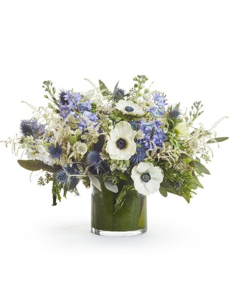 White Anemone + Blue Delphinium with Winter Greens