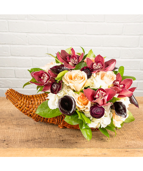 Orchids, Calla Lilies, Ranunculus Cornucopia Centerpiece 
